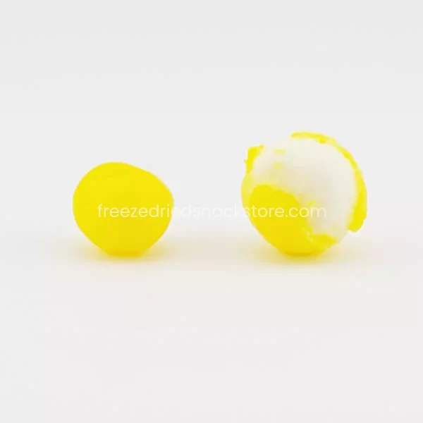 Bright yellow LemHeadz candy, a mouth-puckering treat with zesty citrus flavor.