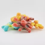 Octopus Gummeez: A Colorful Pile Of Chewy Gummy Candies Shaped Like Adorable Little Octopuses, Perfect For Snacking Or Sharing With Friends.